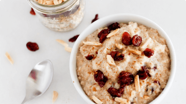 a bowl of oatmeal with cranberries